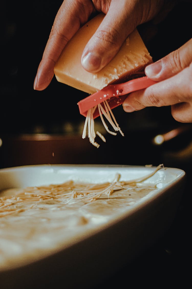 Person Grating Cheese