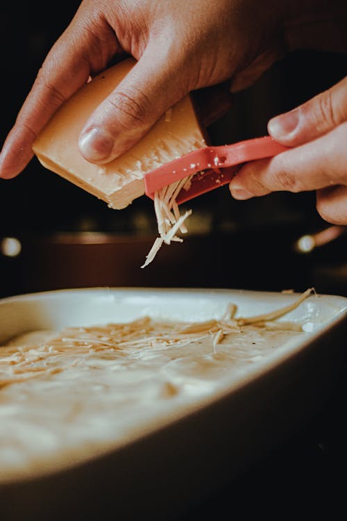 Person Grating Cheese