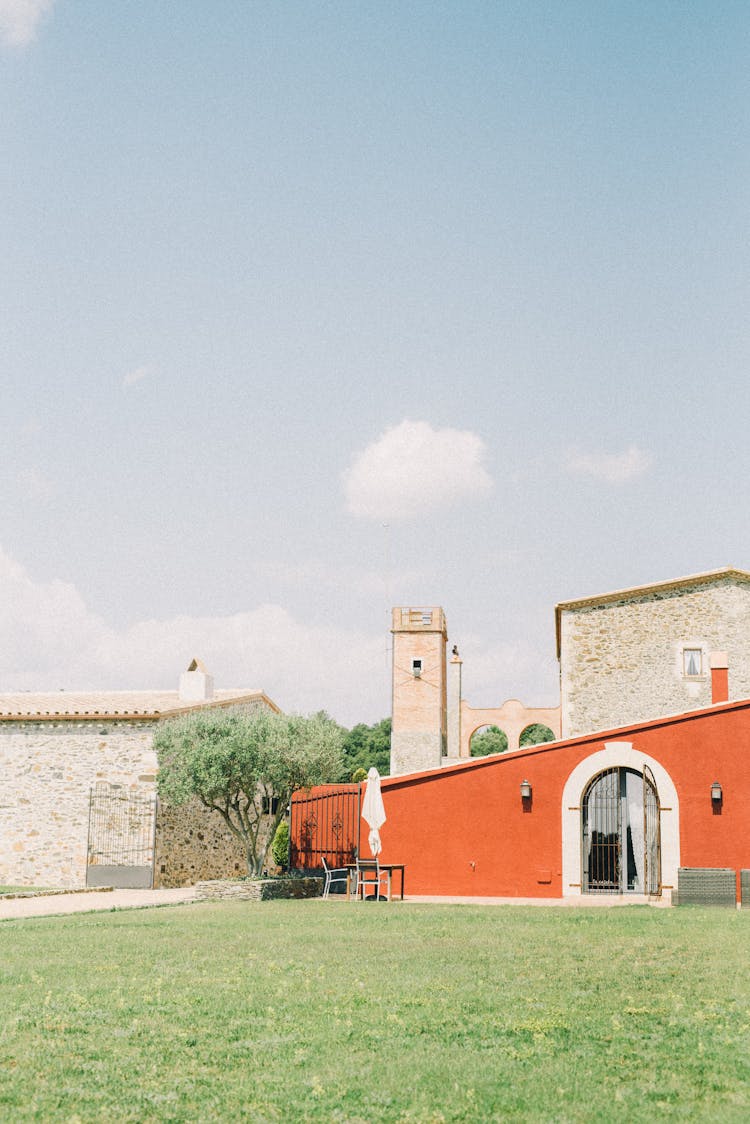 House With Stone Walls And A Lawn