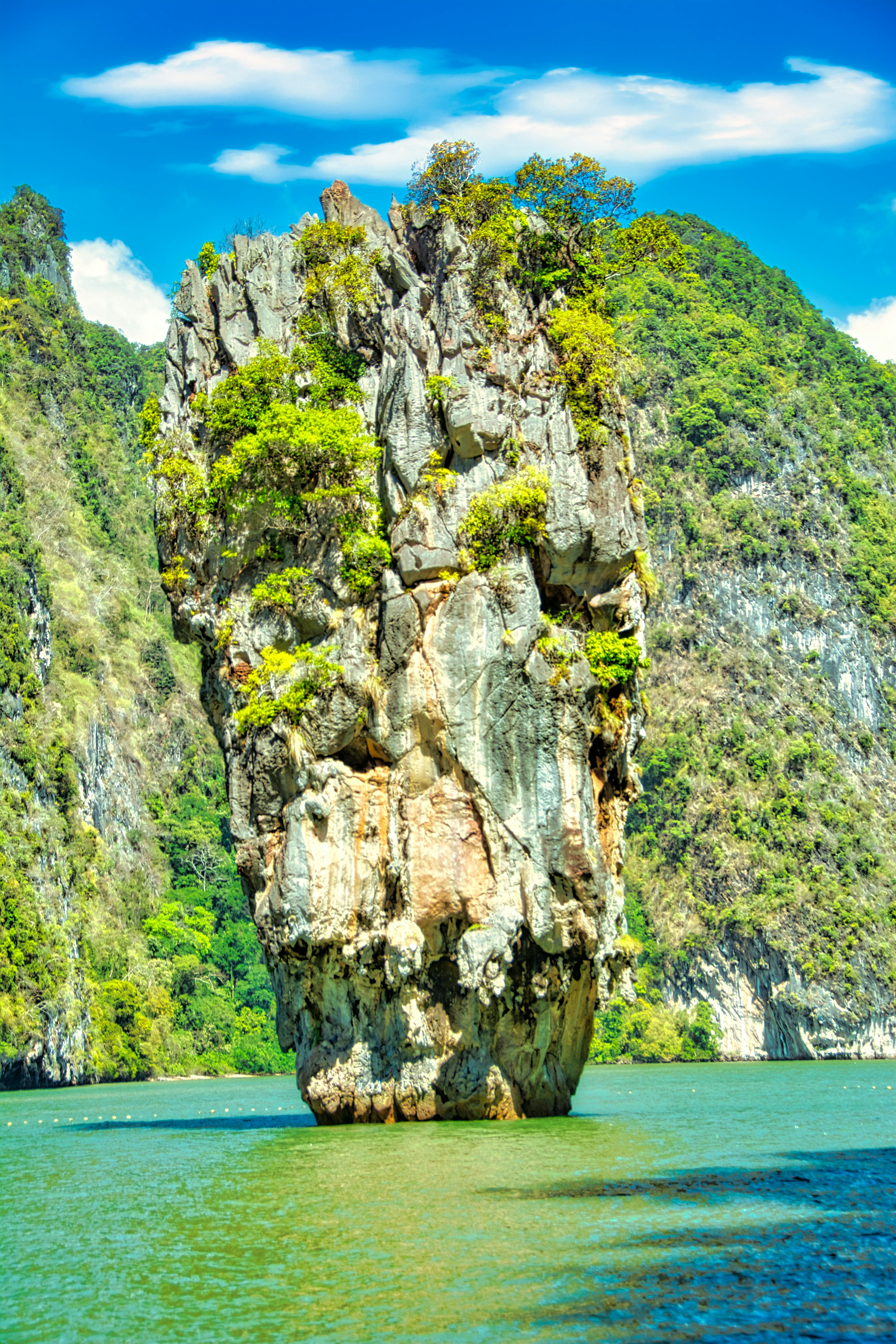 gray rock formation near body of water