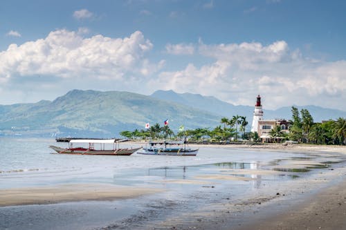 Photo of Watercrafts on Seashore