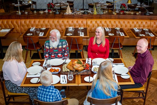 Multi-generational family enjoying a festive meal together at a restaurant in Dubai.