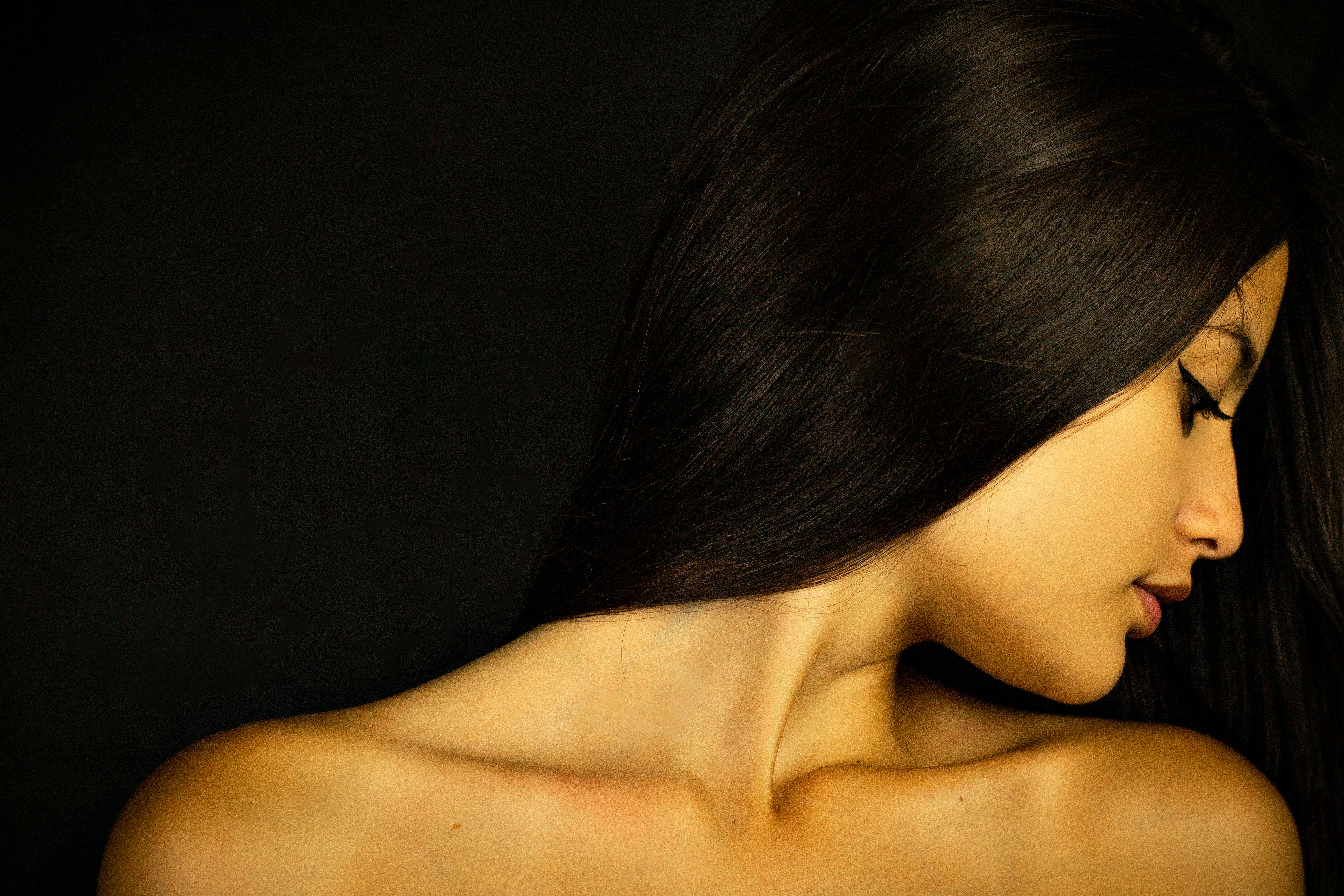 Topless Woman With a Black and Black Background