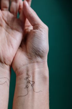 Person With Black Tattoo on Right Hand