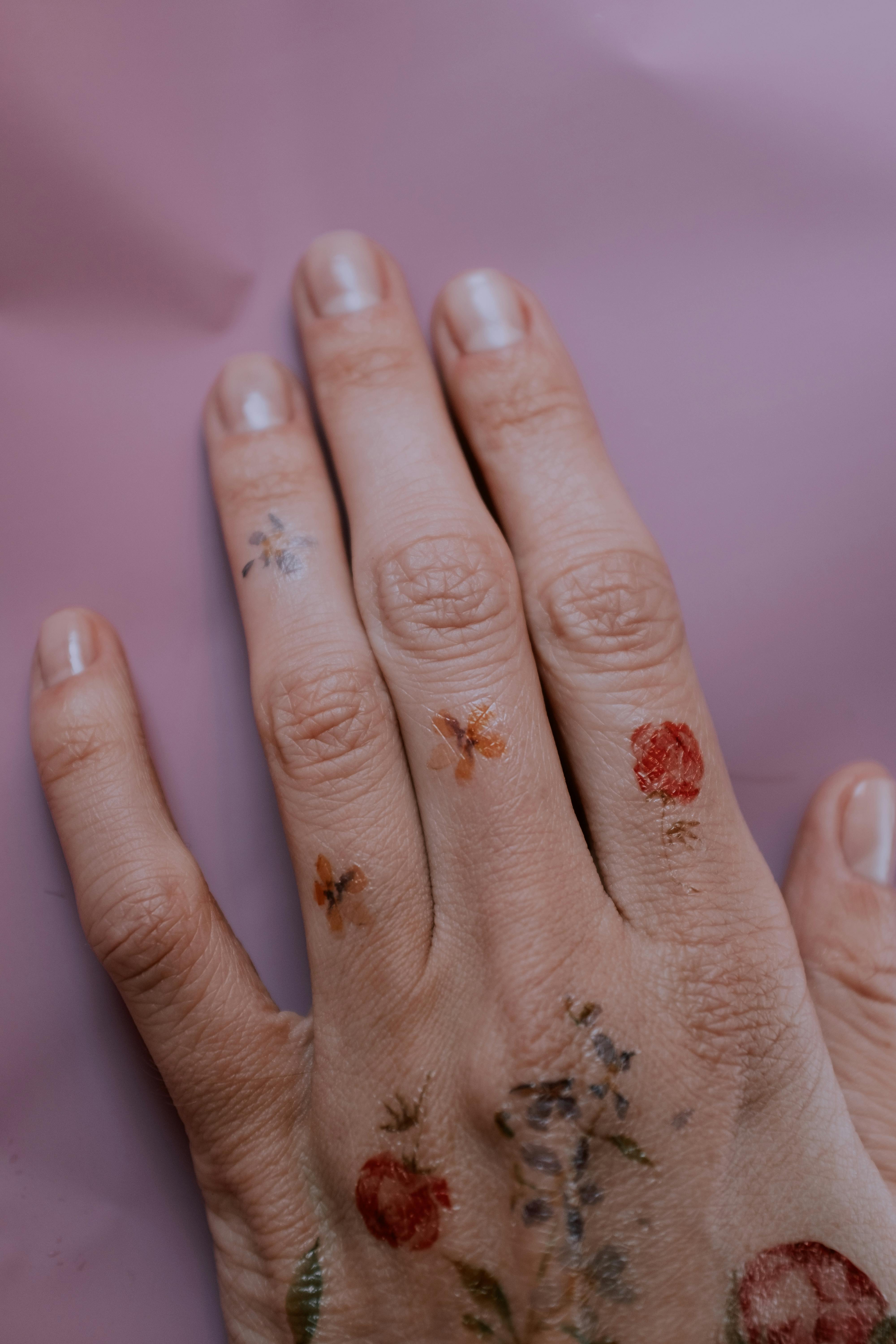 Finger Tattoos  Tattoo Insider  Cool finger tattoos Finger tattoos Flower  finger tattoos