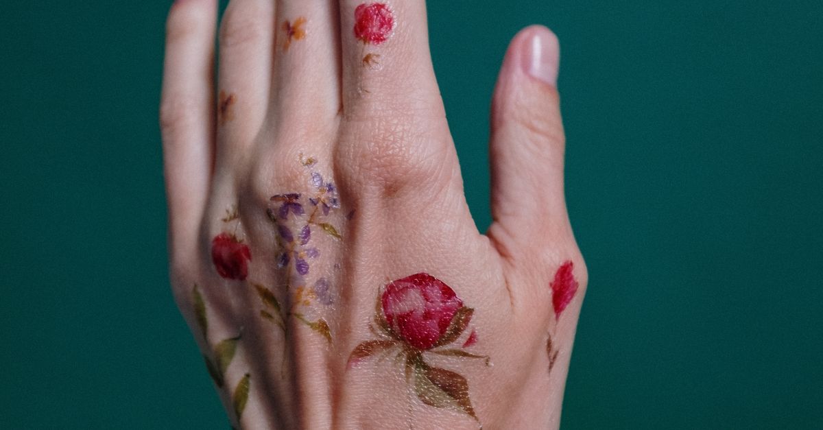 Photo Of Flower Tattoos On Person s Left Hand Free Stock Photo Photo Of Flower Tattoos On Person s Left Hand Free Stock Photo