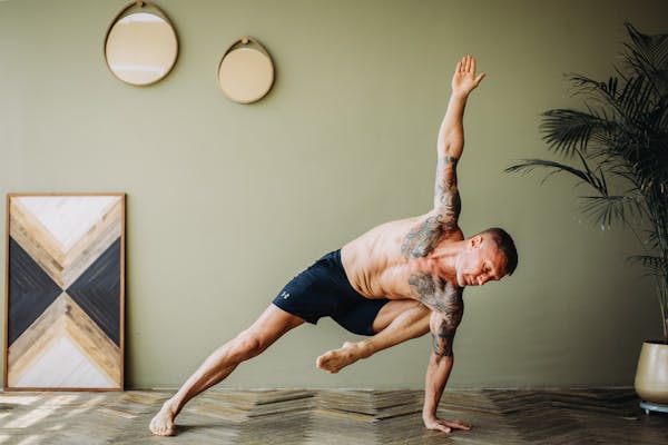 Fitness coach working with client