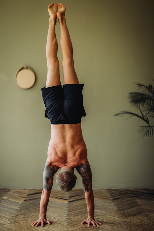 Back View of a Man Doing Handstand