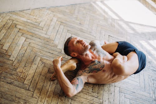 Gratis stockfoto met fitness, flexibel lichaam, houten vloer Stockfoto
