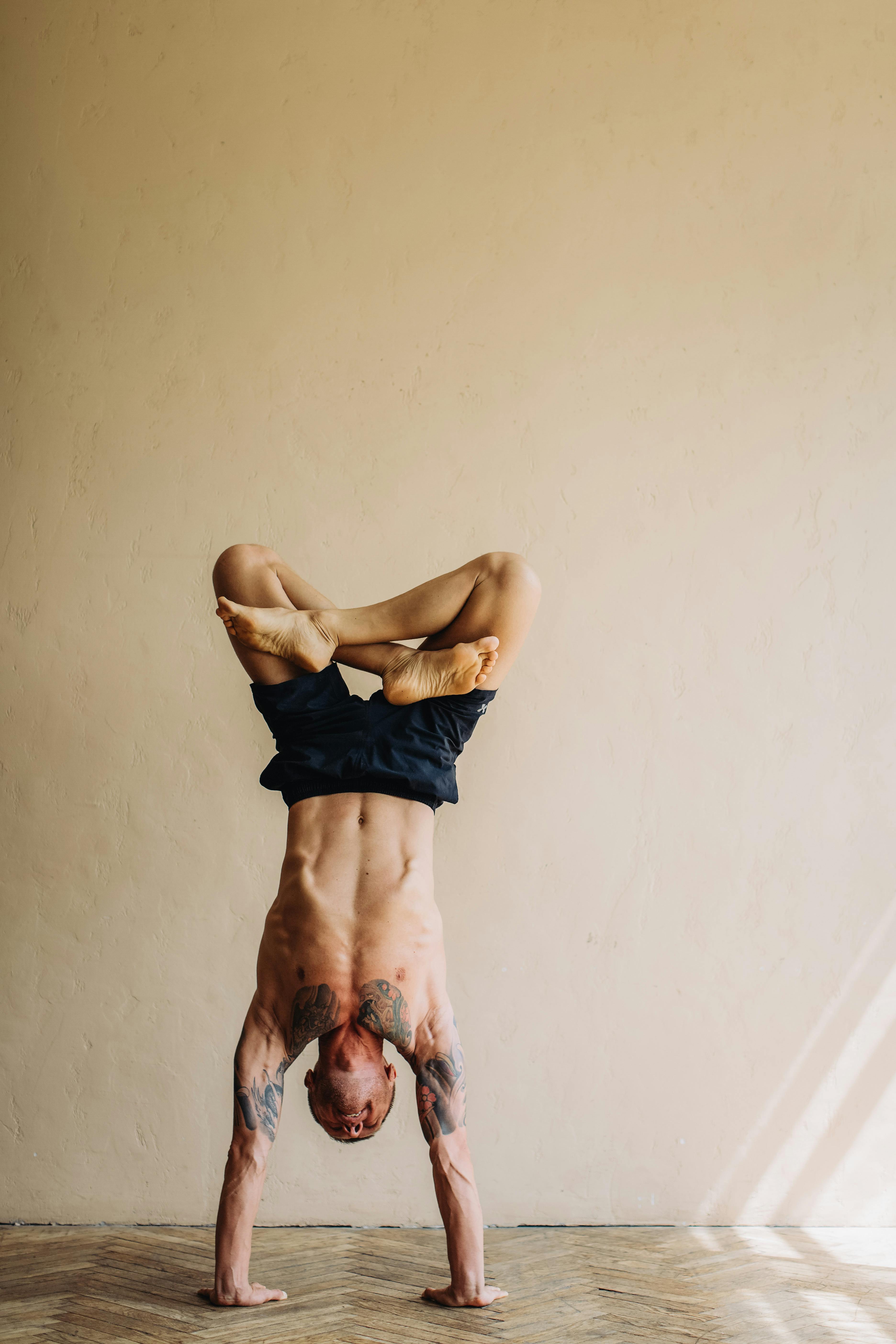 photo of man doing hand stand