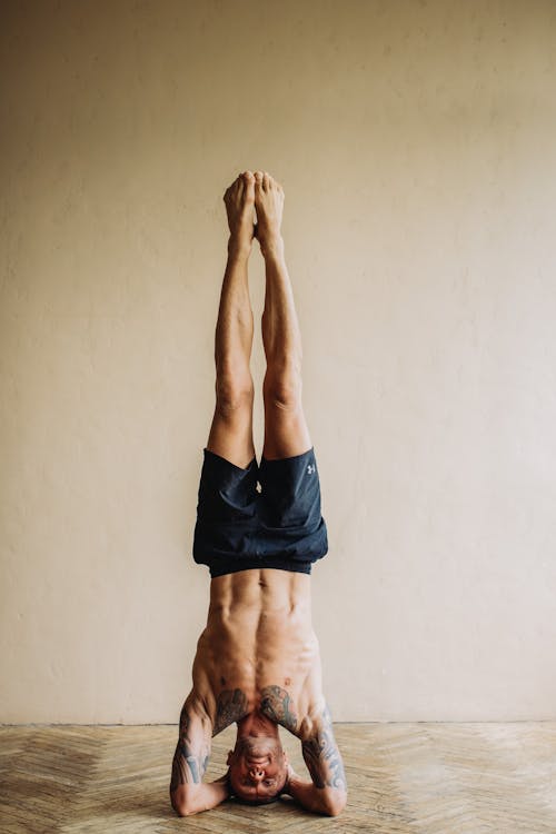 Photo of Man Doing Head Stand