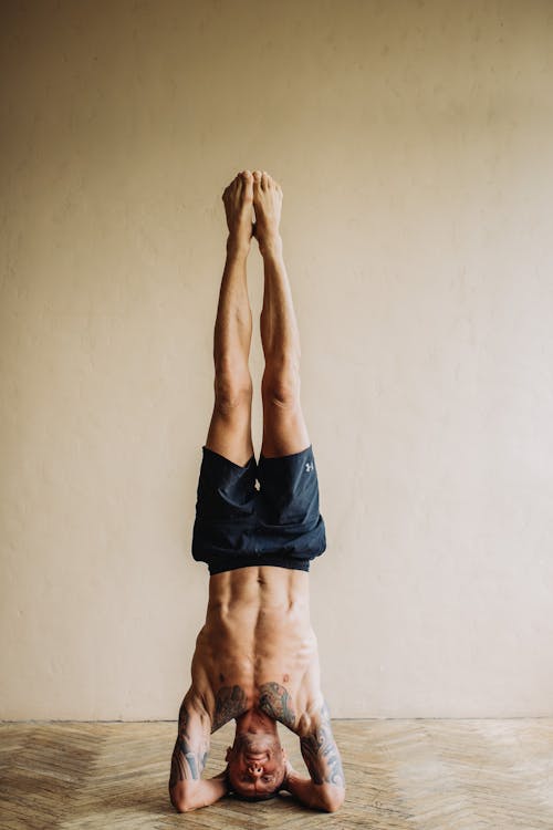 Free Photo of Man Doing Head Stand Stock Photo