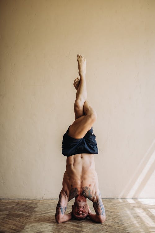 Free Photo of Man Doing Head Stand Stock Photo