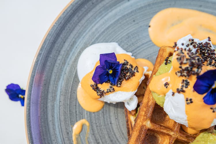 Edible Blue Flowers With Seeds On Top Of Food