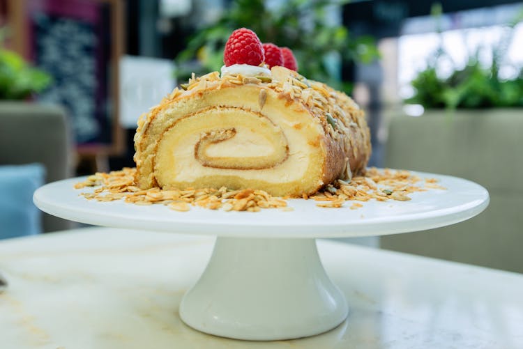 Rolled Cake On White Footed Cake Stand