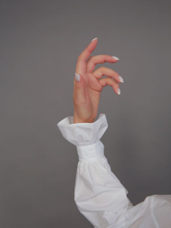 Crisp white manicure on short nails