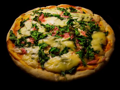 Pizza With Green Leaf Vegetable