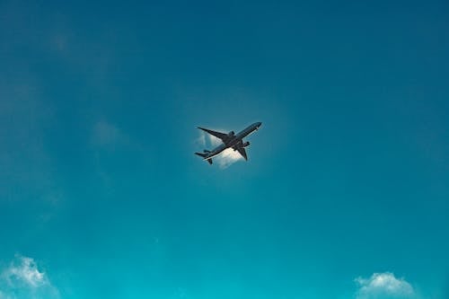 Free White Airplane Flying in Mid Air Stock Photo