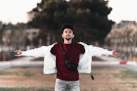 Shallow Focus Photo of Man in Red Shirt and Shorts