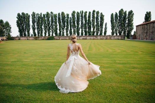 A bride in a stunning gown gracefully walks across a lush garden in Italy, capturing elegance and romance.