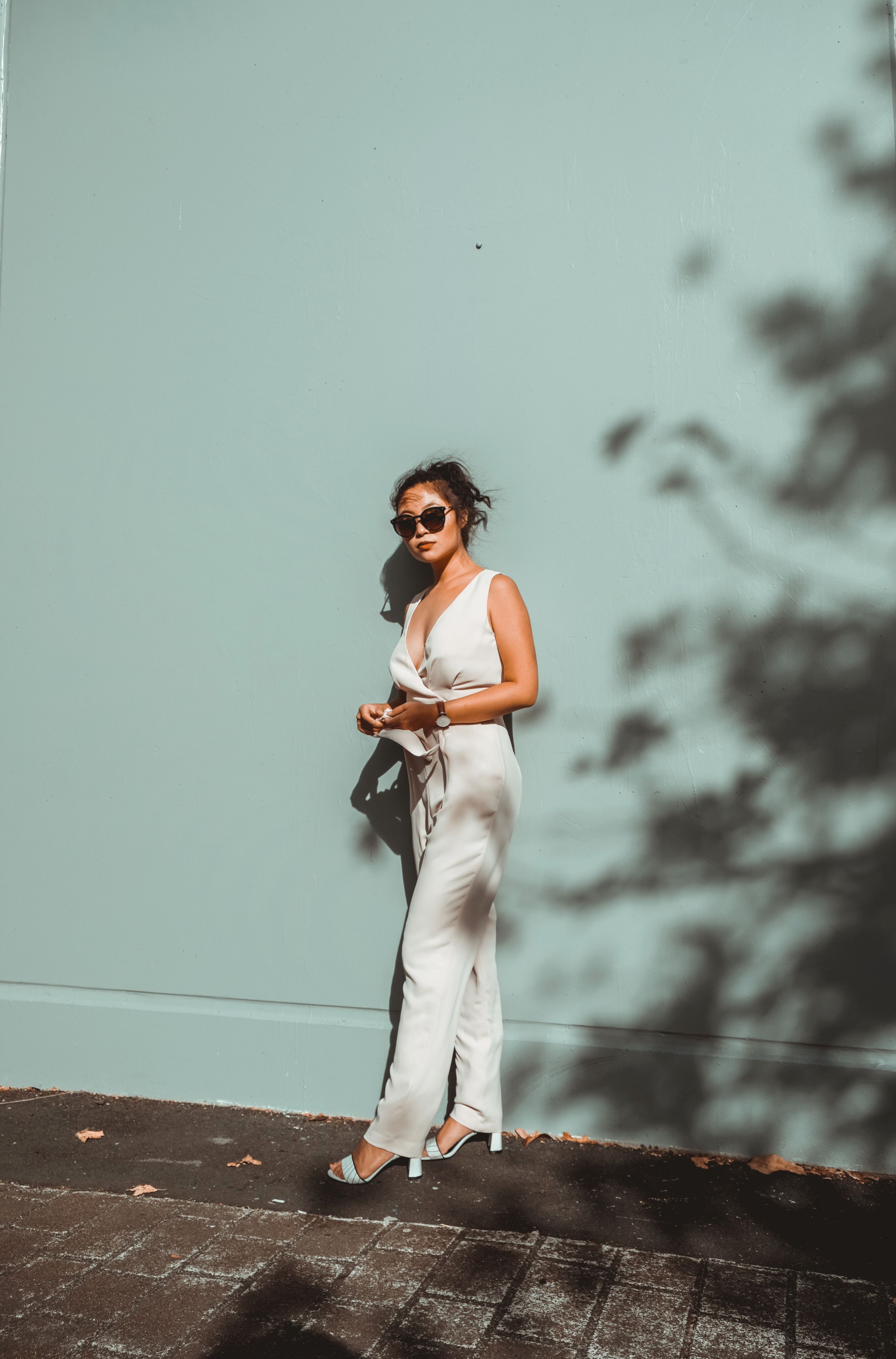 Woman wearing a casual jumpsuit for daytime brunch