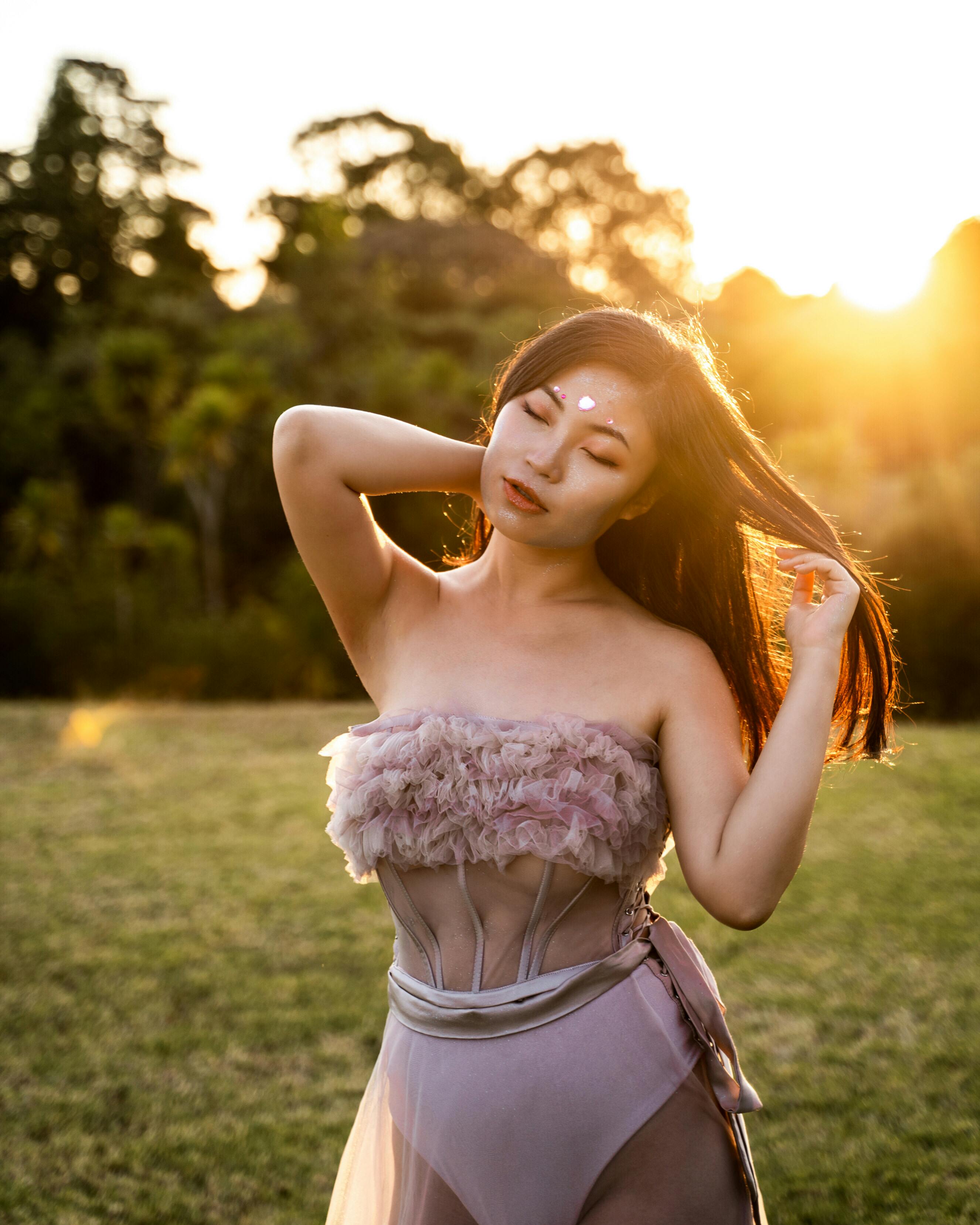 photo of woman wearing pink dress