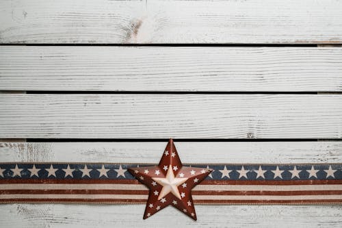 Photo Of American Flag On Top Of Wooden Surface