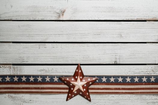 Decorative American star on rustic wood, symbolizing patriotism and freedom.
