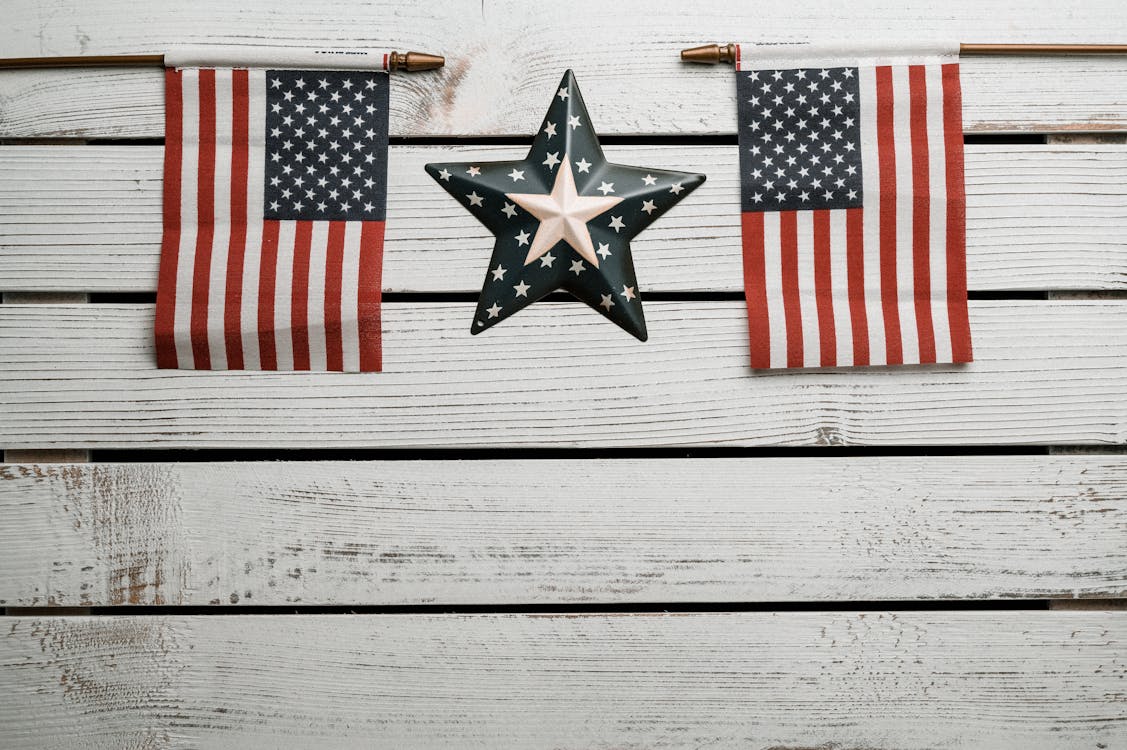 American Flags on White Wooden Wall