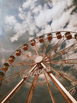 Captivating view of the Voyager Ferris wheel set against a dramatic cloudy sky.
