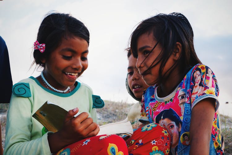 Photo Of Children Sitting Together