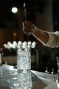 Person Pouring Water on Clear Drinking Glass