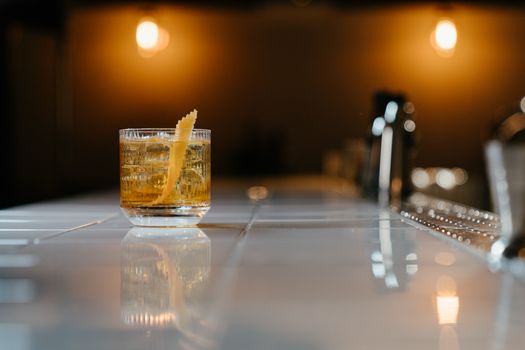 Clear Drinking Glass With Yellow Liquid on Table