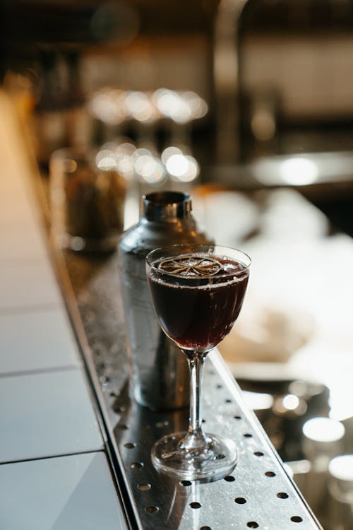 Clear Wine Glass on Stainless Steel Bar