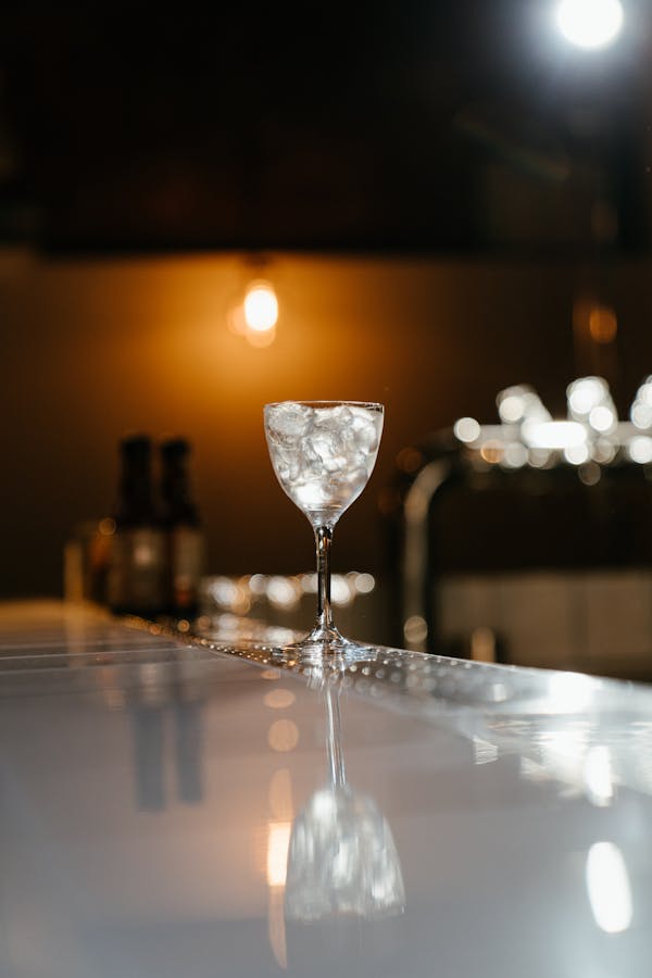 Clear Wine Glass on Table