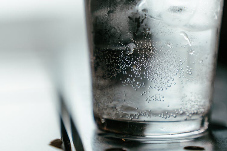 Water In Clear Glass Bottle