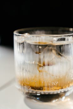 Close-up of a cold beverage with ice in a clear glass offering a refreshing visual.