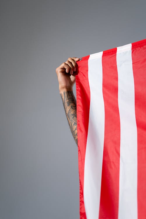 Free Hand Holding an American Flag Stock Photo