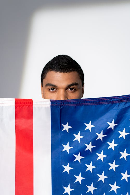 Man Behind an American Flag