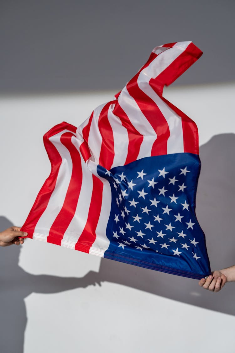 Hands Holding An American Flag