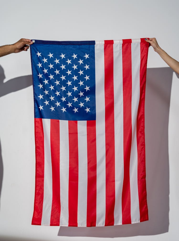 Hands Holding An American Flag