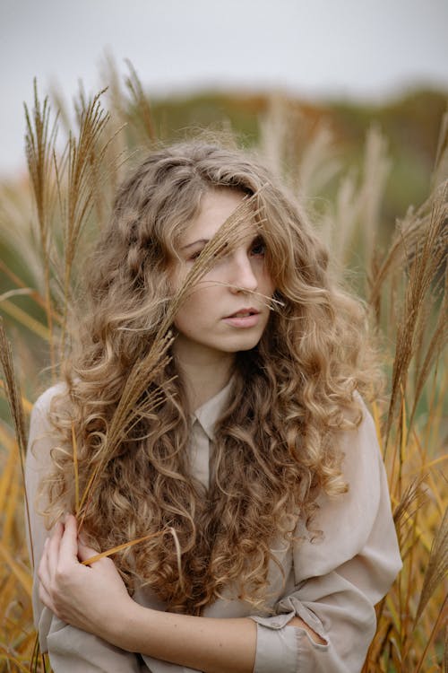 Free Photo Of Woman Standing On Wheat Field Stock Photo