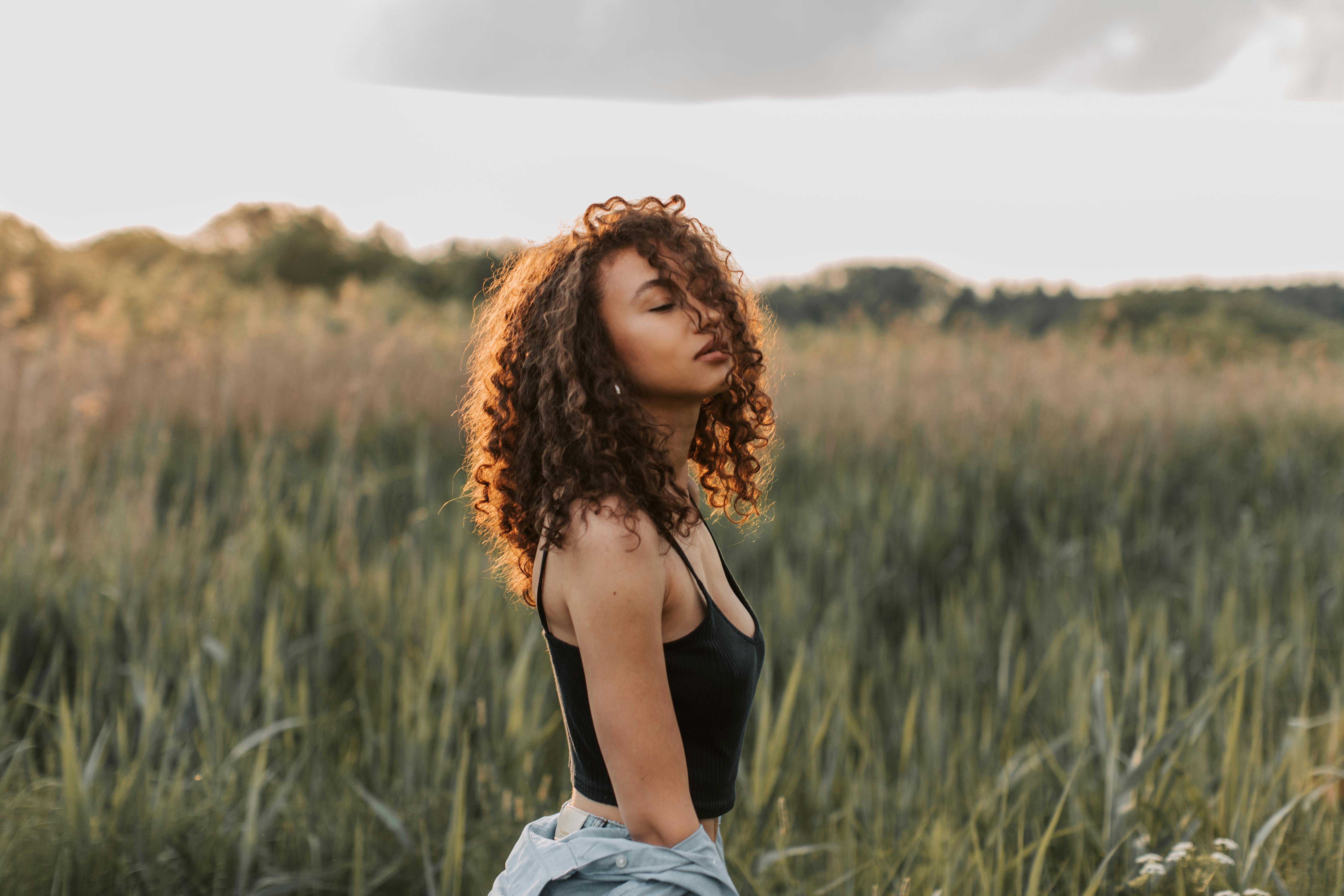 photo of woman wearing black top