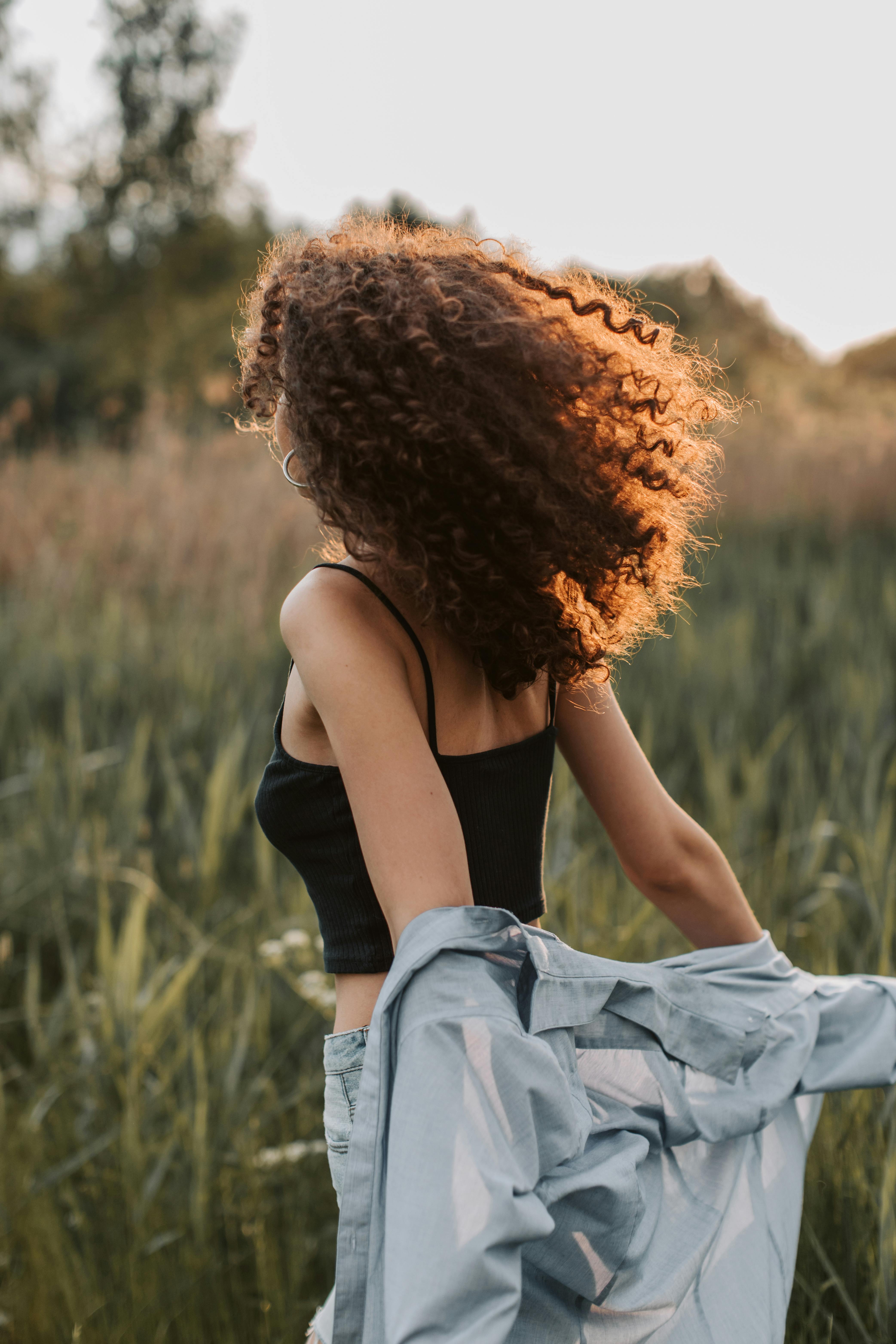 photo of woman wearing black tank top