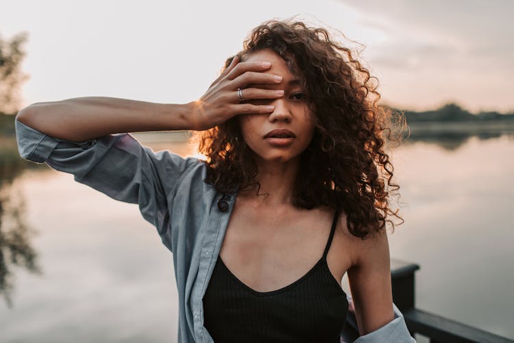 A Woman Covering Her Eye