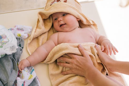 Free Photo Of Baby Covered In Yellow Blanket Stock Photo