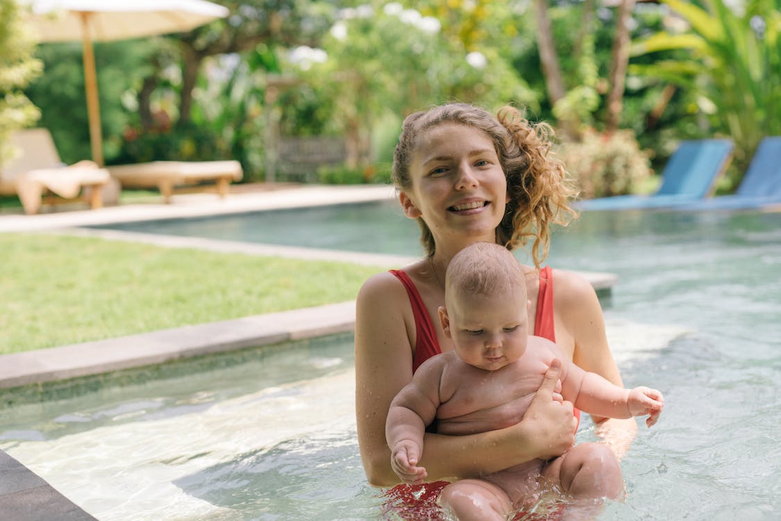 mom and baby in pool on themommiesreviews.com