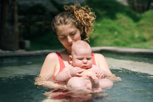 Free Photo Of Woman Holding Baby Stock Photo