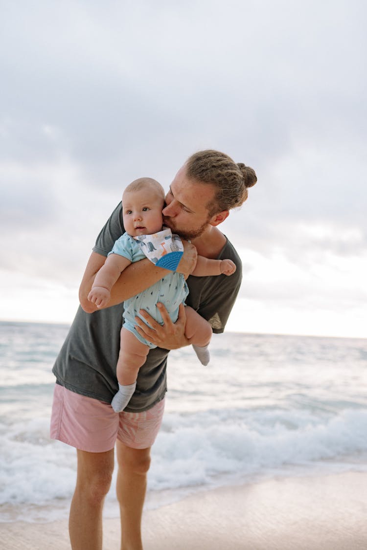 Father And Baby At The Beach