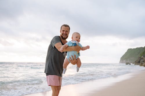 Free Father and Baby at the Beach Stock Photo